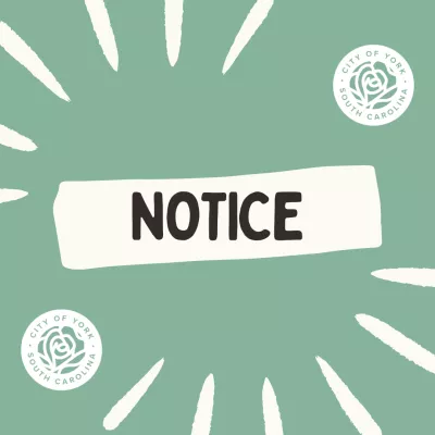 Green post with City of York logos and the word Notice